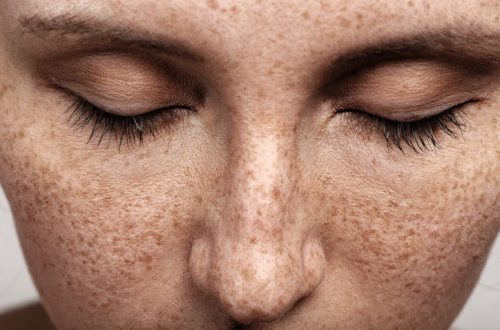 young woman with a freckles natural beauty makeup look closeup portrait