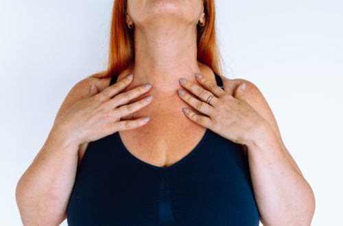 unrecognizable middle-aged woman showing skin on neck, wrinkles